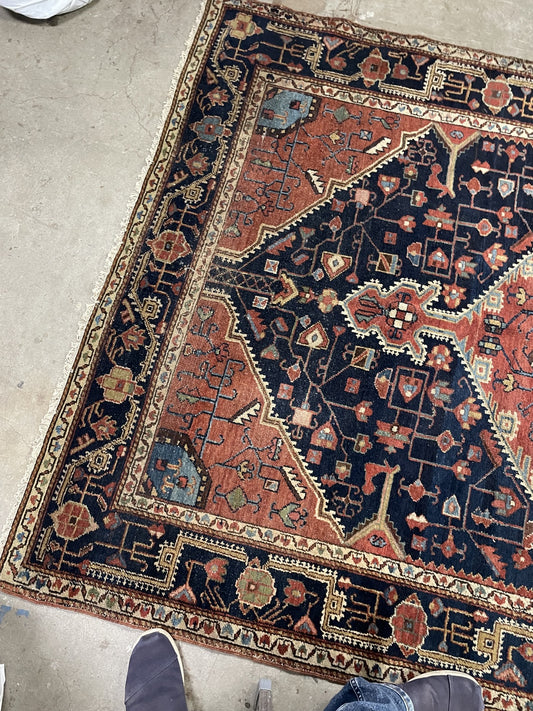 Coral corner panels and navy floral borders on antique rug 1B1021
