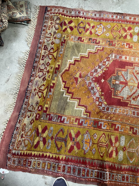 Folded corner showing the patterned reverse and burgundy flatwoven end