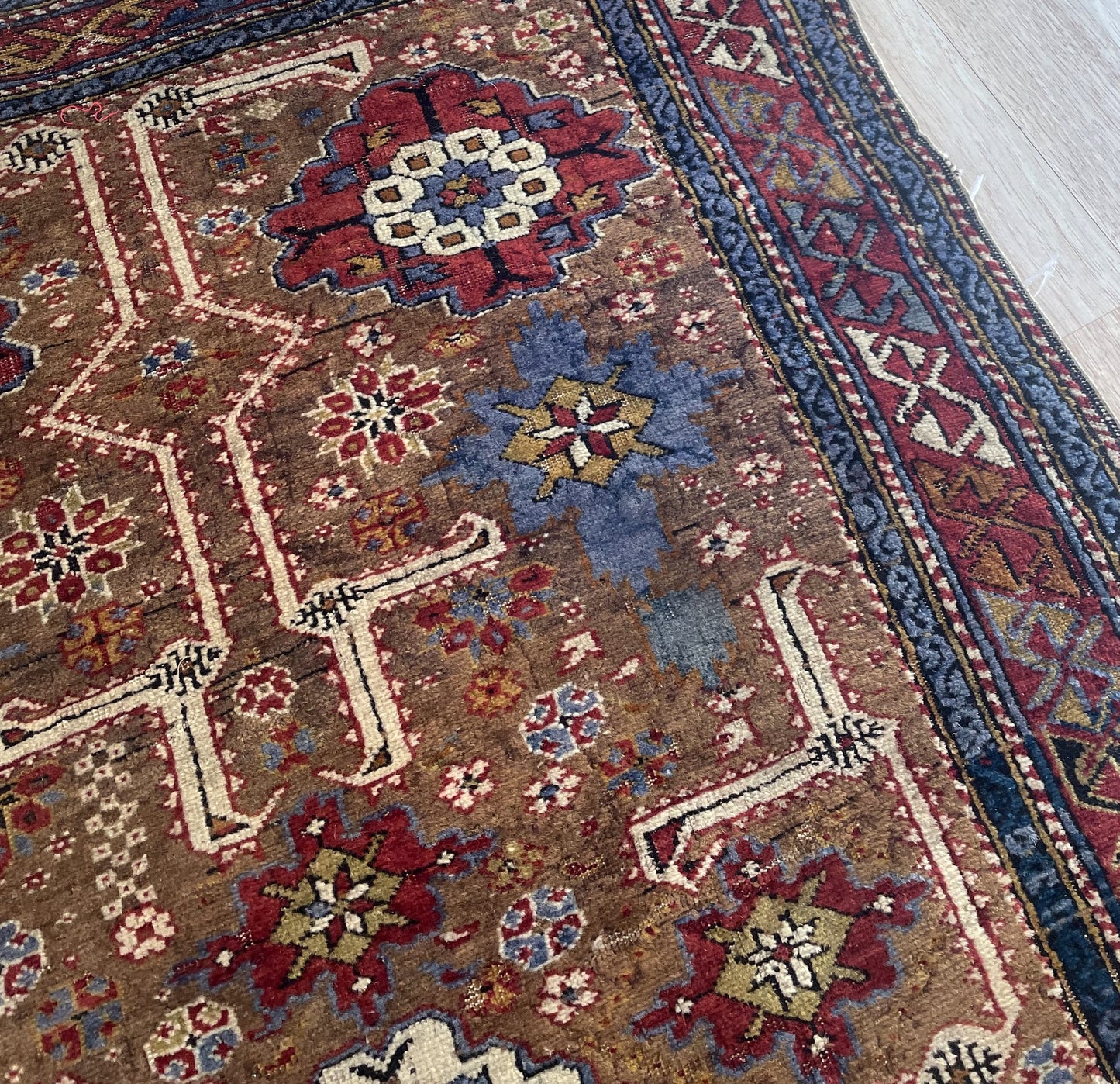 Antique Caucasian Kuba rug low-sheen wool pile texture with honest age wear and patina