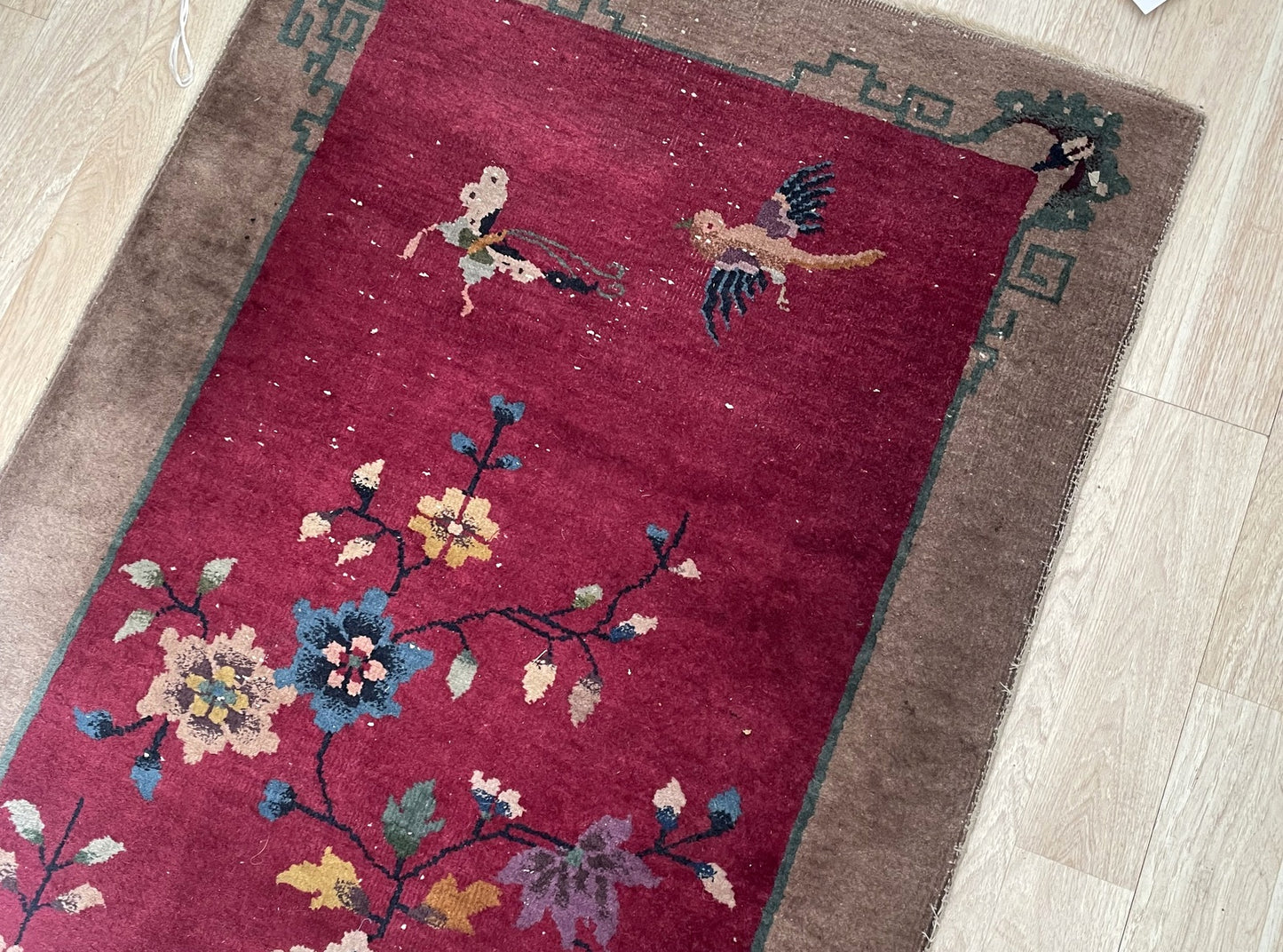 Antique Chinese carpet with red magenta field navy blue sage green and gold color palette