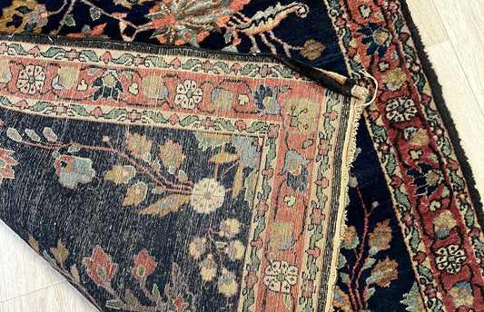 Early 20th century Persian Mahajiran rug with luminous pile and sophisticated floral sprig design on floor