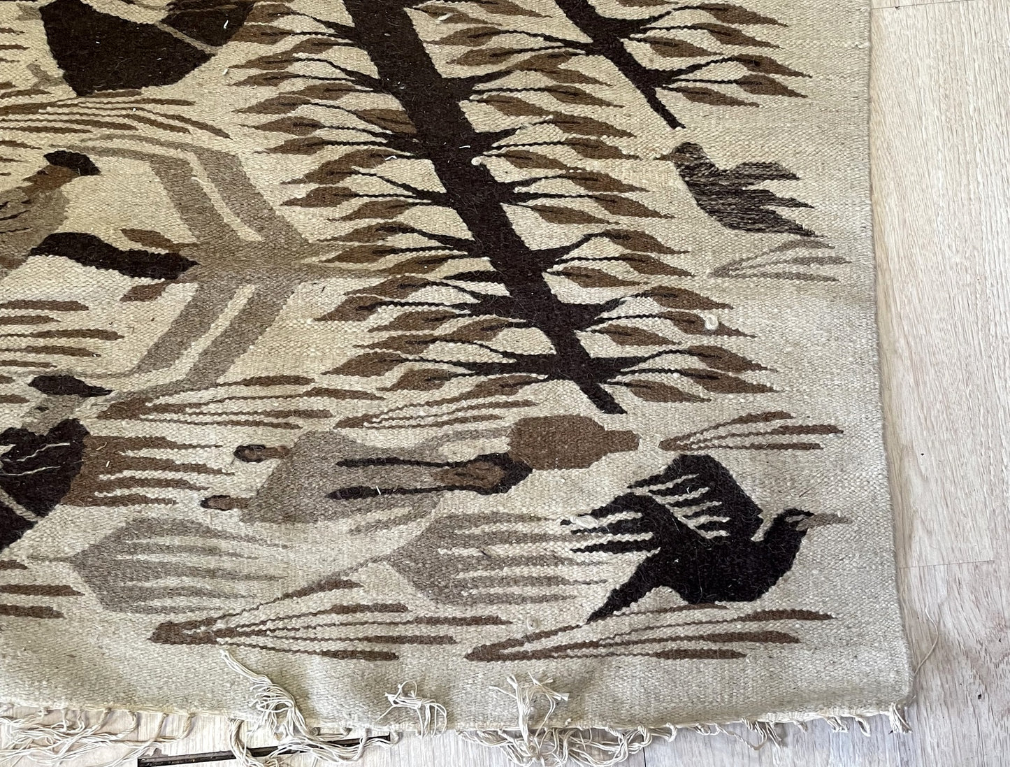 Complex centered Diamond of the Sun medallion on vintage Mexican flatweave geometric rug