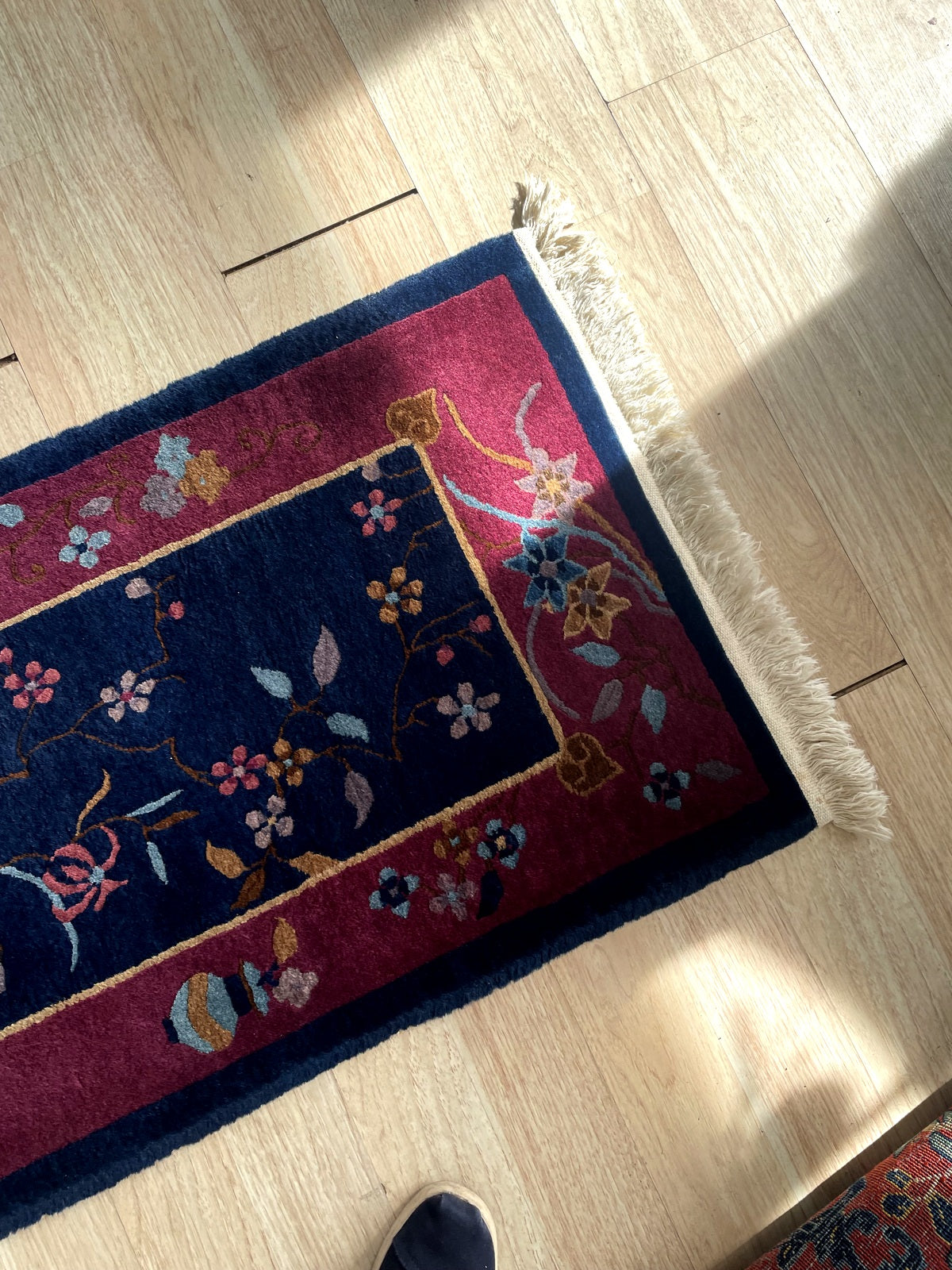 Reverse side view of hand-knotted construction on antique Chinese wool rug with cotton foundation