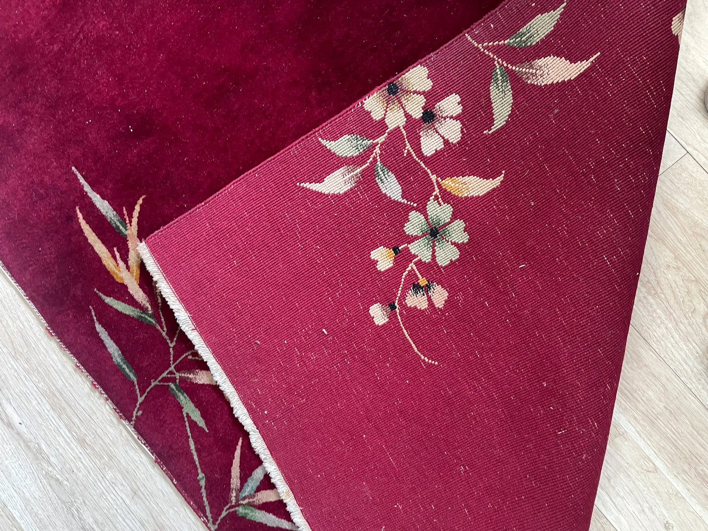 Close-up of elegant floral motifs rendered with intense chrome dyes retaining remarkable vibrancy after a century
