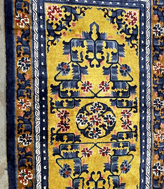 Handmade Chinese silk rug full view, golden yellow field with symmetrical design