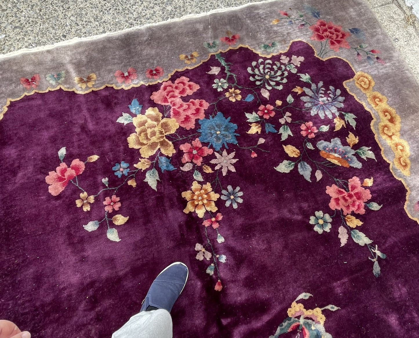 Collector-quality 1920s Chinese Art Deco wool rug with a painterly composition of peonies, dahlias, and wildflowers in teal, amber, and blush pink on an aubergine field.