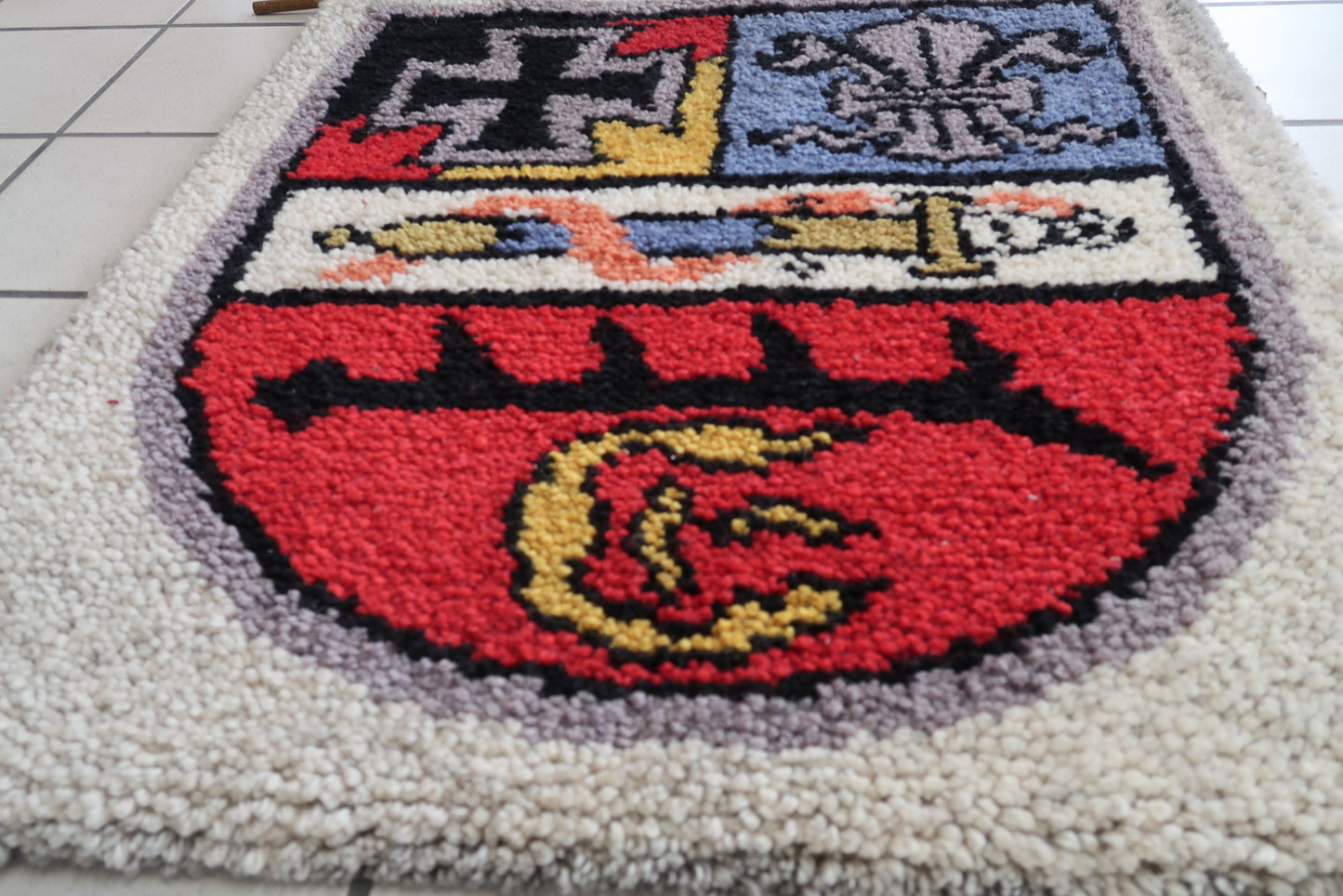 Intricate Patterns in Red and Black on Antique Rug
