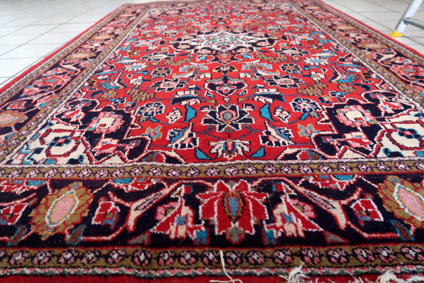 Side angle view of the rug, highlighting its thickness and plush texture