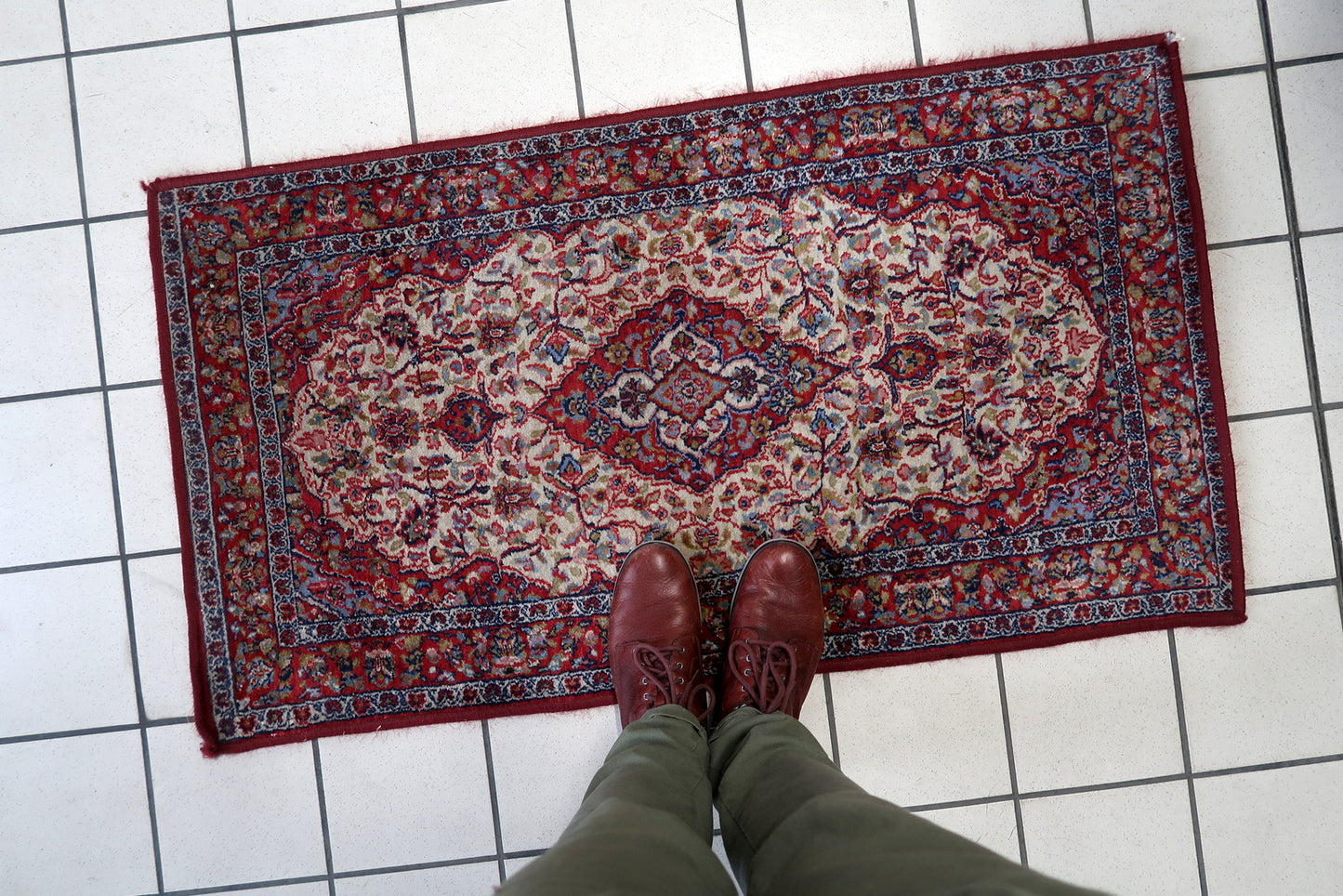 Side angle view of the rug, highlighting its thickness and plush texture