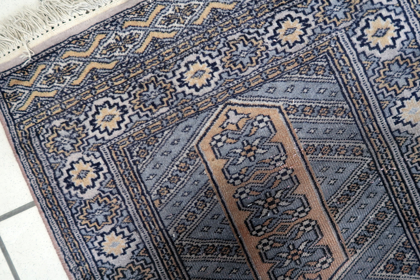 Central Asian rug with classic octagonal gul motifs