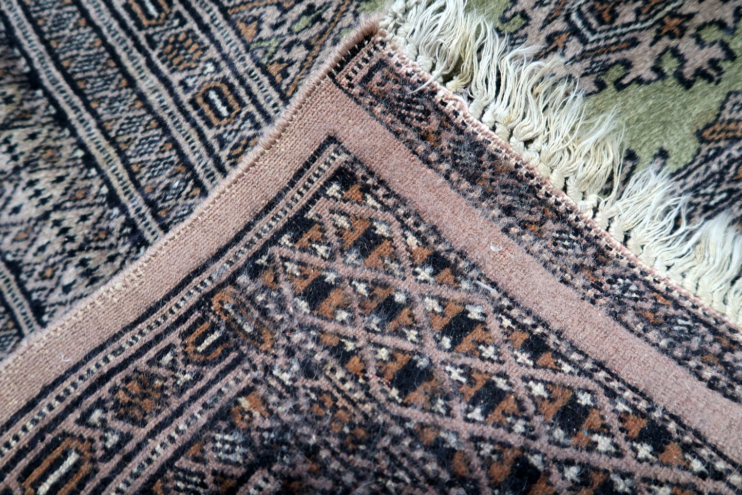 Artisan hand-knotted rug from Bukhara tradition