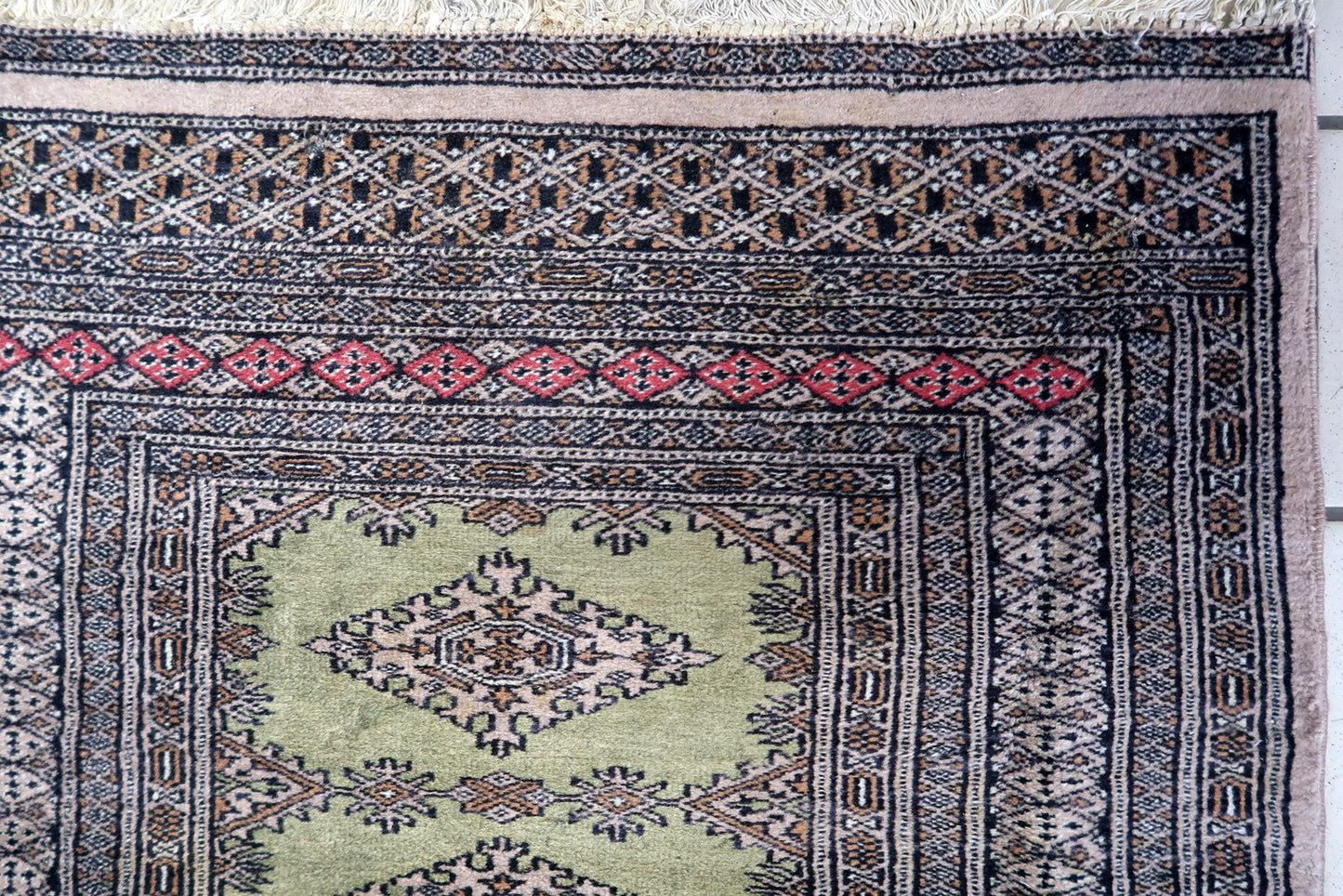 1950s hand-knotted wool rug from Uzbekistan