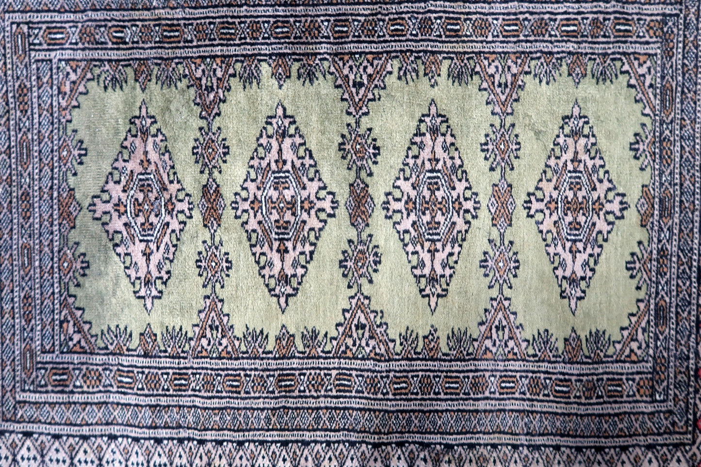 Full view of vintage Bukhara carpet