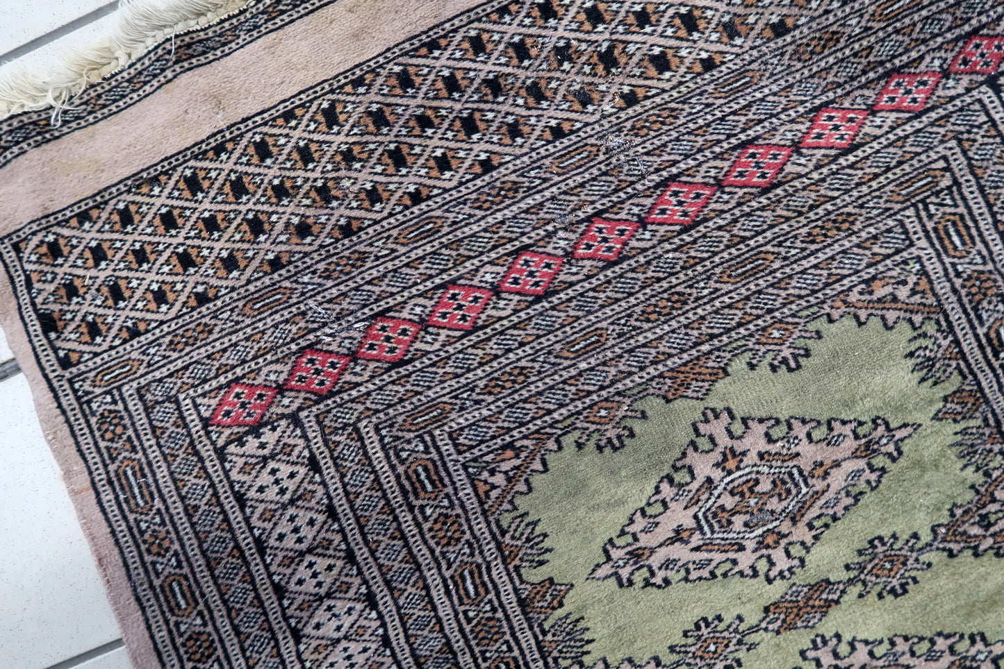 Compact size tribal wool rug