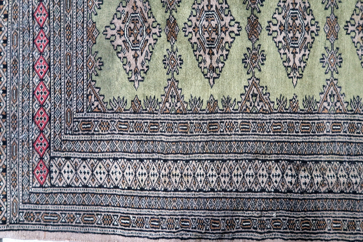 Detailed wool texture of Uzbek rug