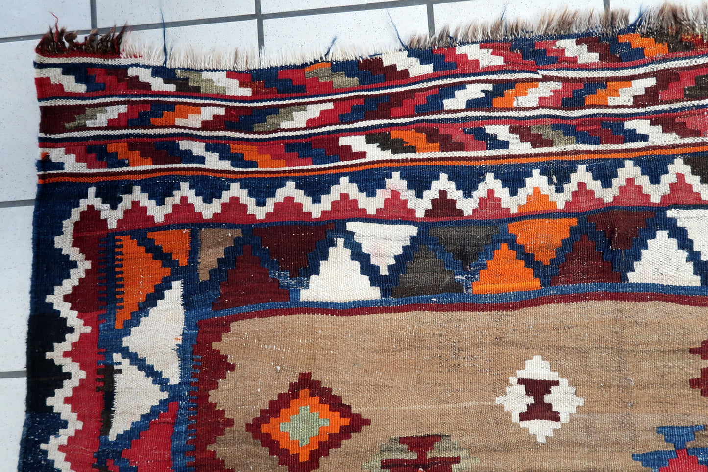 Handwoven Persian flatweave rug with tribal motifs