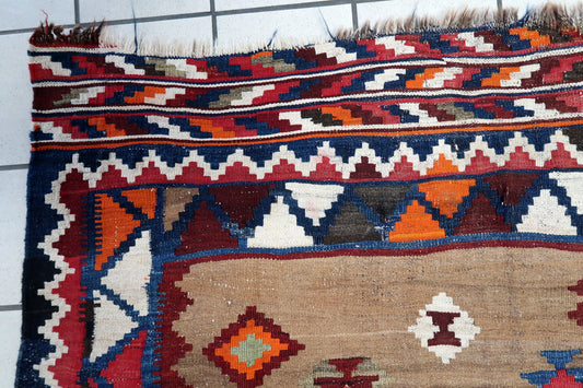 Handwoven Persian flatweave rug with tribal motifs