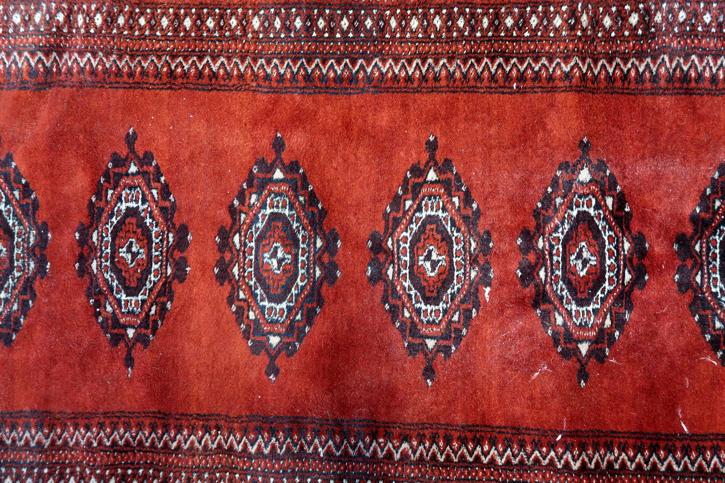 Detail of traditional gul pattern in dark blue and cream
