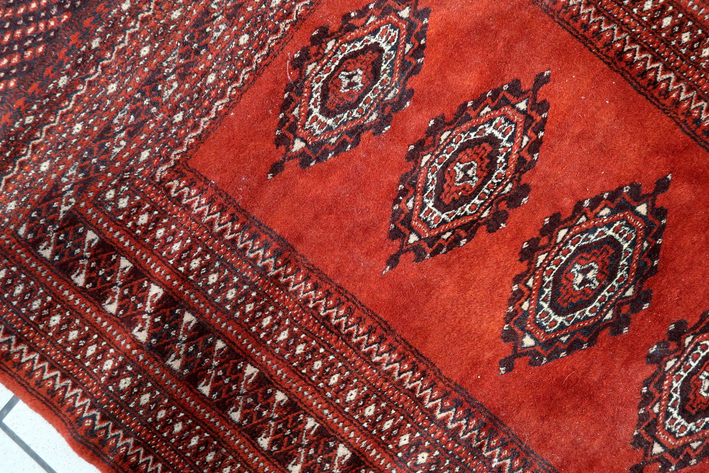 Central Asian red rug with geometric design