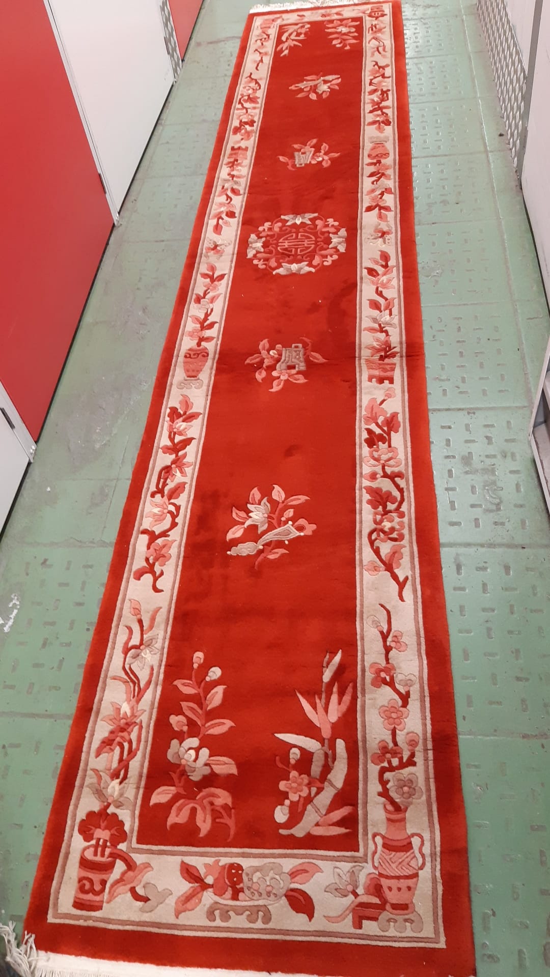 Red and ivory Chinese rug perfect for hallways