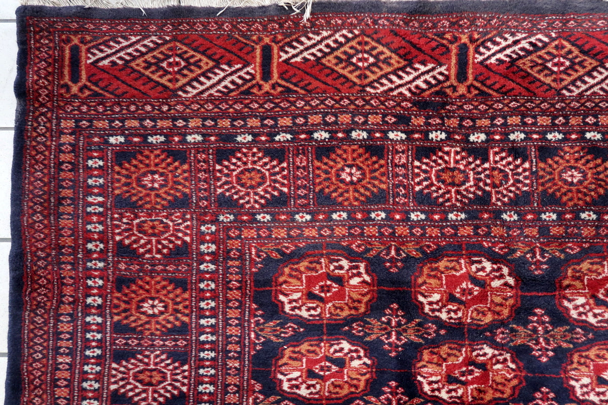 The rug placed under a dining table, adding elegance to the space