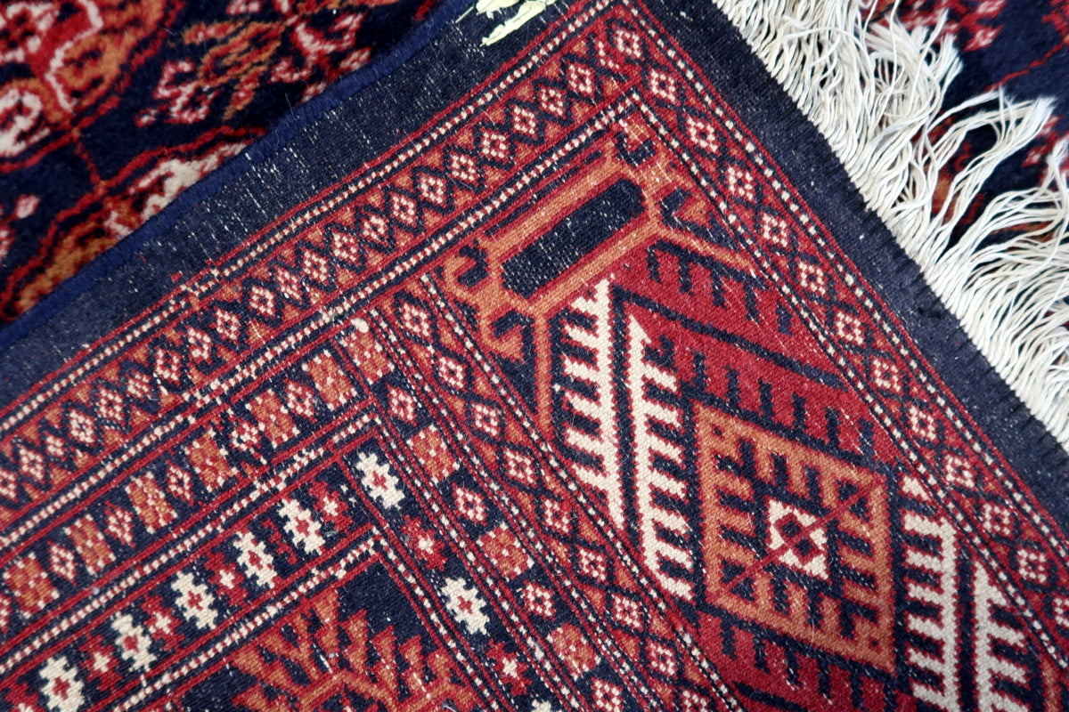 The rug on a wooden floor, complementing rustic and bohemian decor
