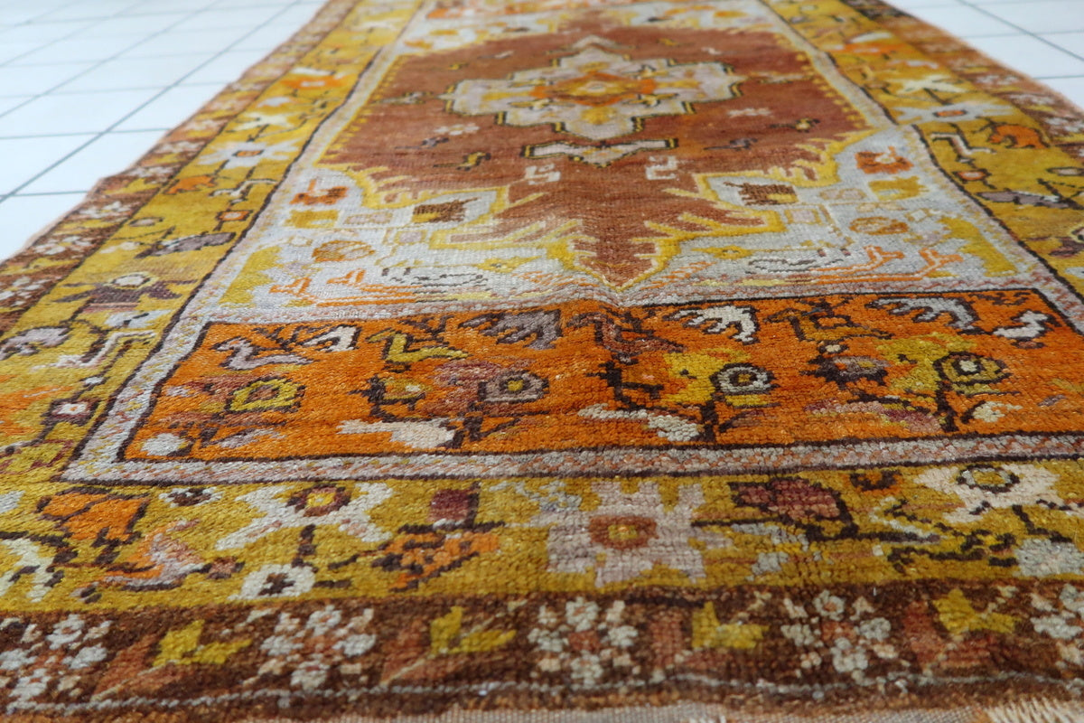 Minor low pile areas adding to the character of the vintage Anatolian carpet