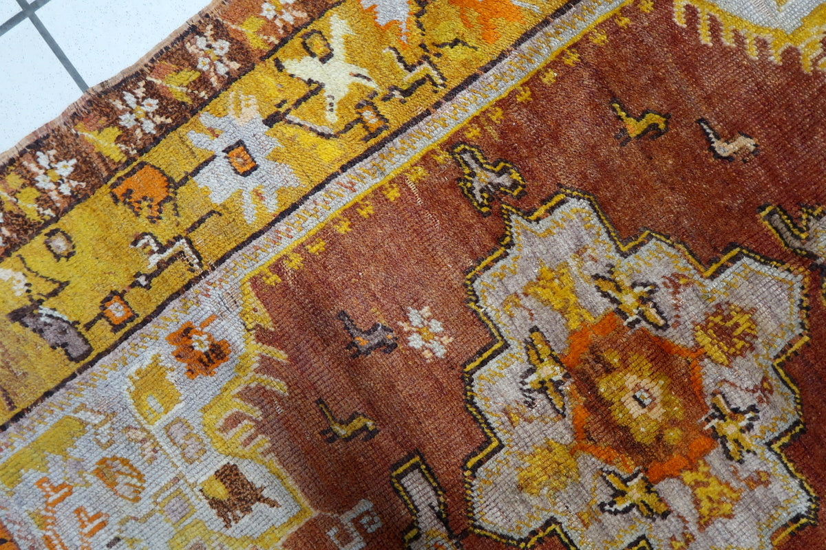 Subtle color variations from natural vegetable dyes in the antique handwoven rug