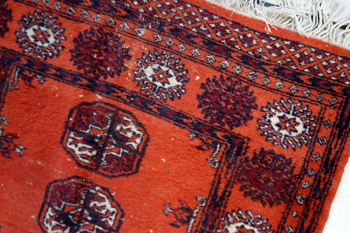 Full-length image of the vintage Uzbek runner, showing its elegant narrow design