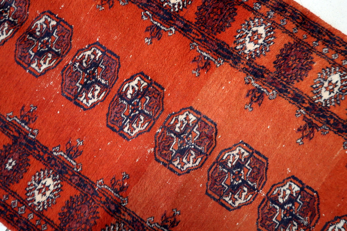 Fringed ends of the vintage Bukhara runner, showcasing traditional craftsmanship