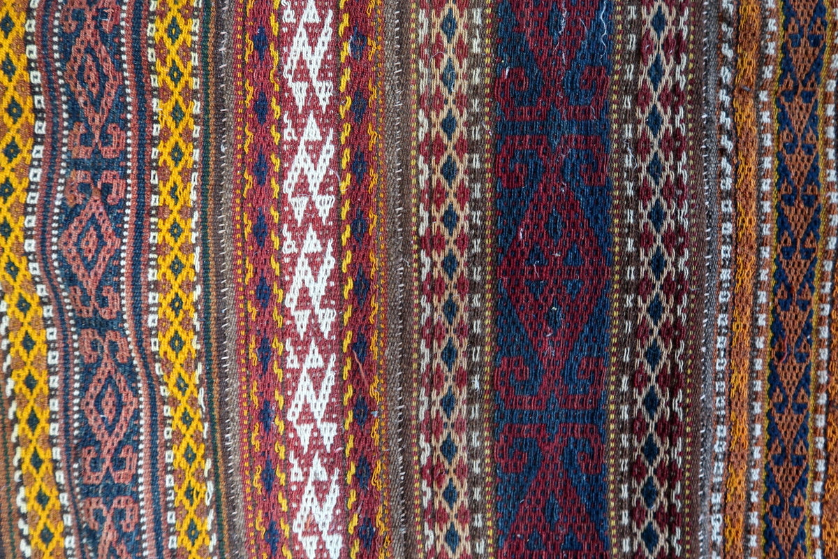 1930s handmade Berber Kilim rug styled in a cozy bohemian-inspired interior