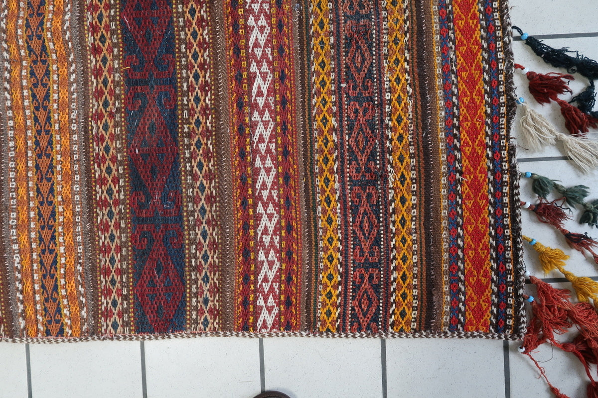 Traditional Amazigh symbols in a geometric Moroccan Kilim rug with bold contrast