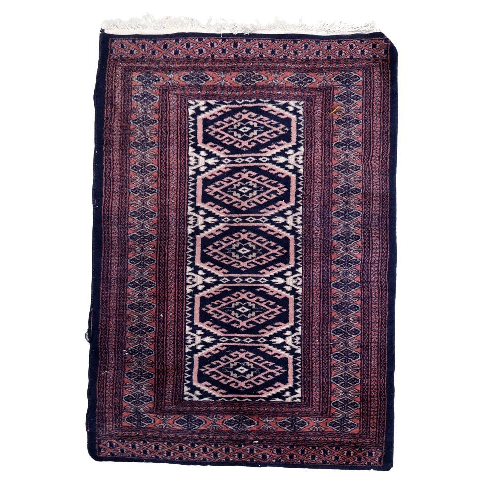 Handmade vintage 1960s Uzbek Bukhara rug with geometric octagonal medallions