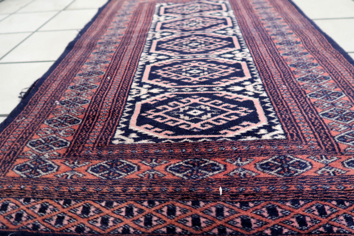 Full view of the small Uzbek rug, ideal for vintage or bohemian interiors