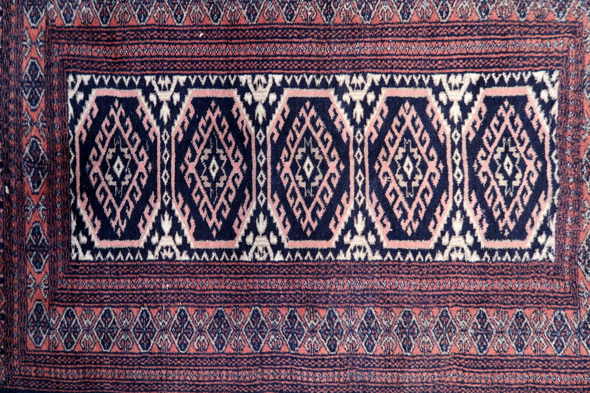 Soft wool texture and finely handwoven details of the antique Bukhara rug