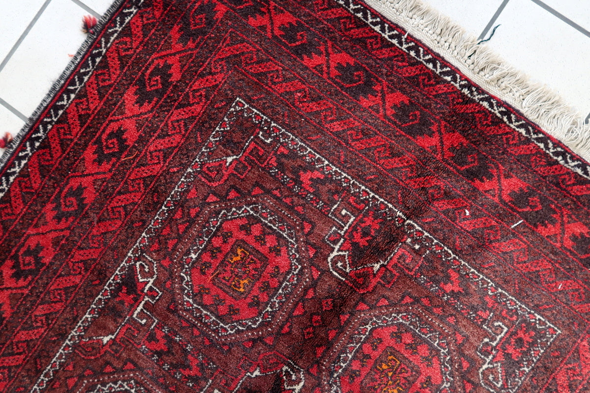 Detailed shot showing the hand-knotted wool construction of the rug