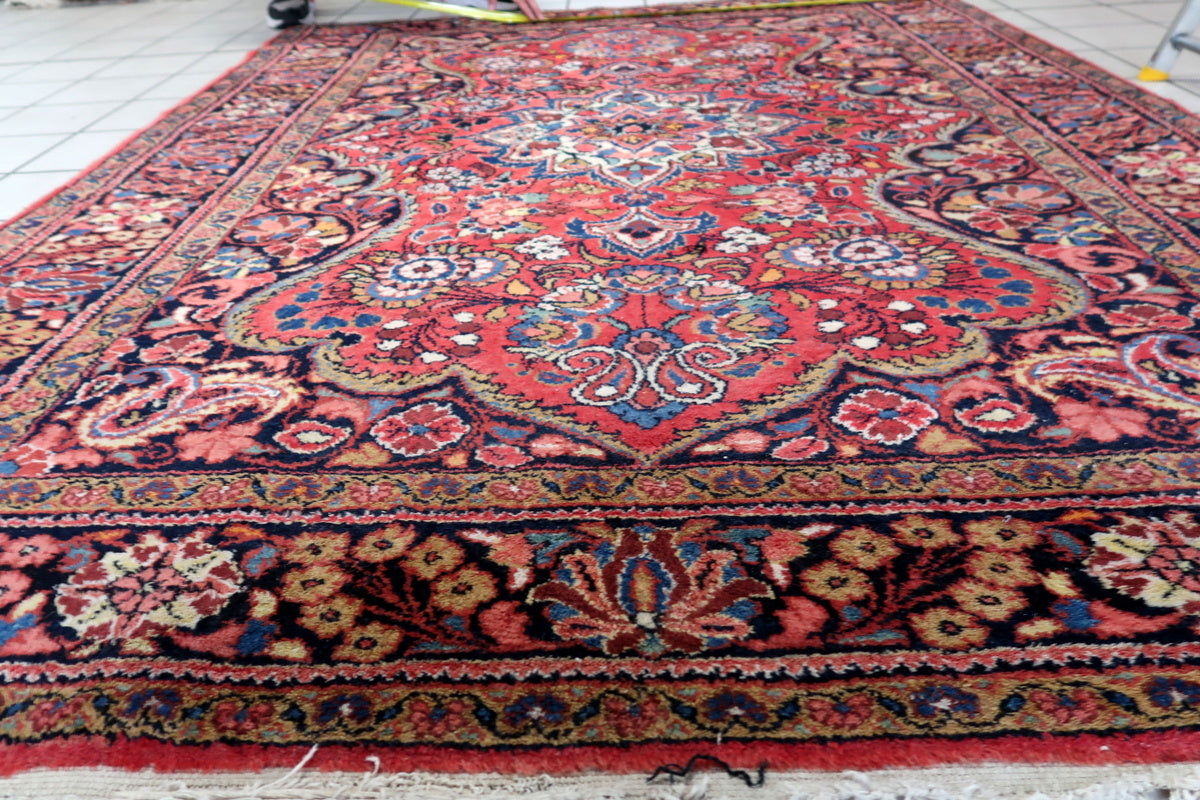 A cozy living room featuring the rug as a centerpiece