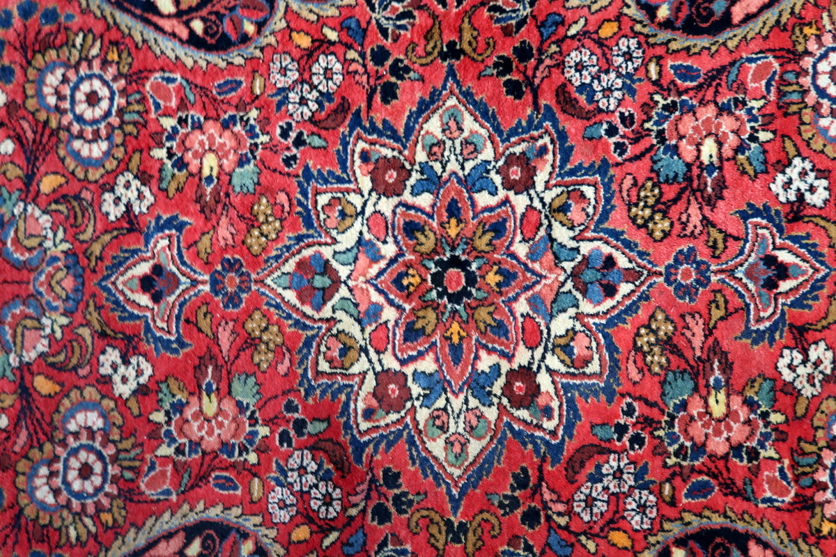 Image highlighting the elegant floral borders surrounding the central medallion