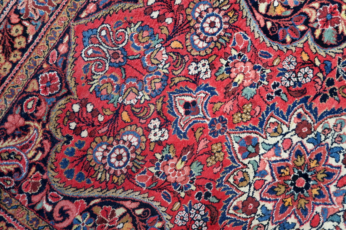 A room setup featuring the Persian Mashhad rug as a statement piece