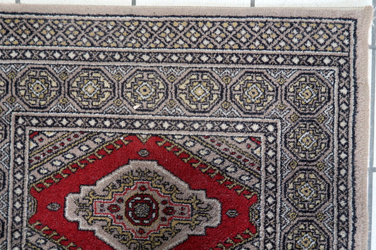 Close-up of intricate geometric motifs on a 1970s German rug