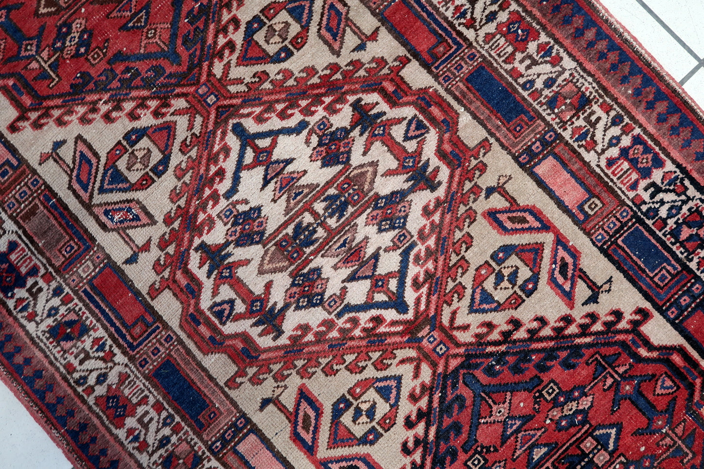 Fringe details on a 100-year-old Persian Serab carpet