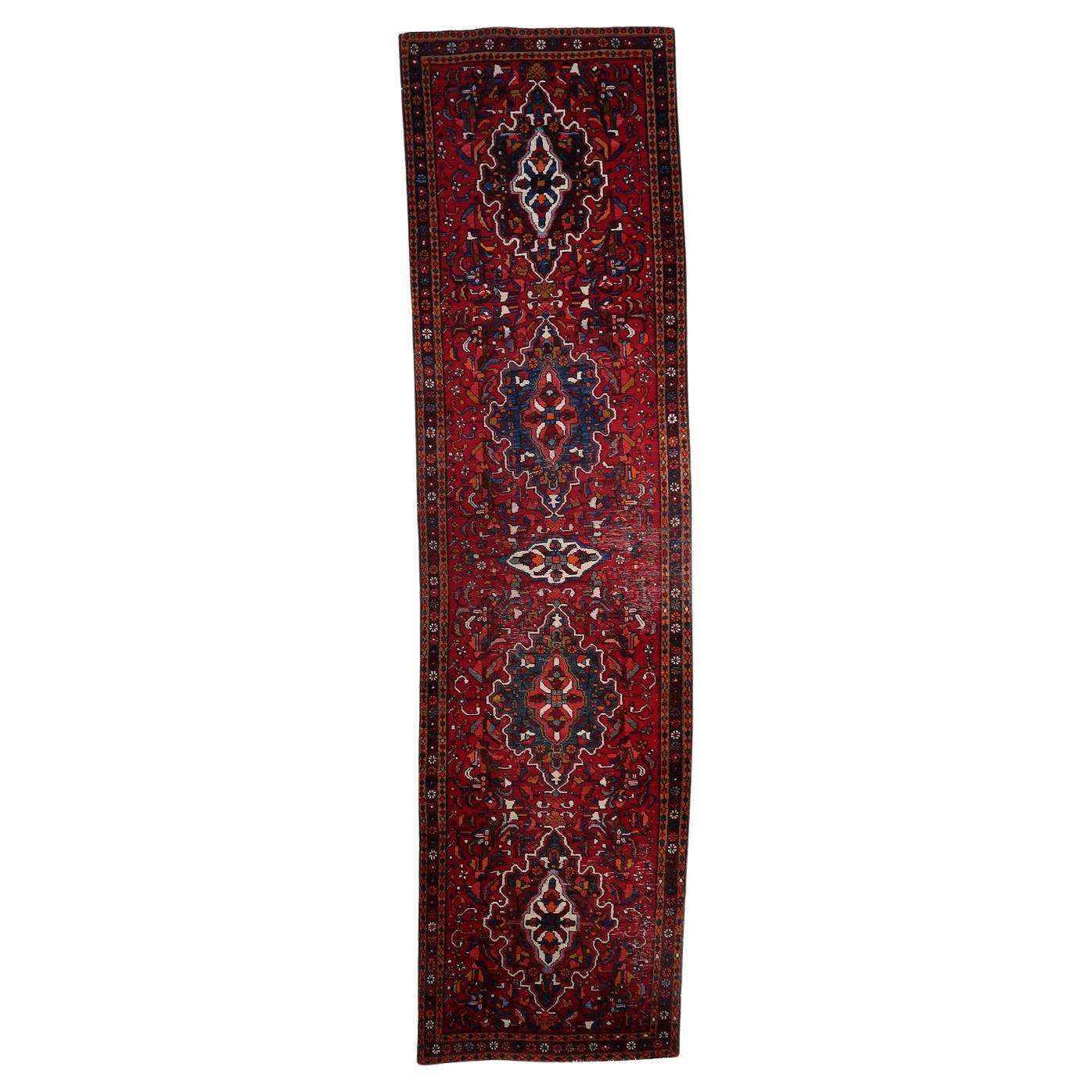 Handmade antique Persian Karajeh runner rug with intricate tribal patterns