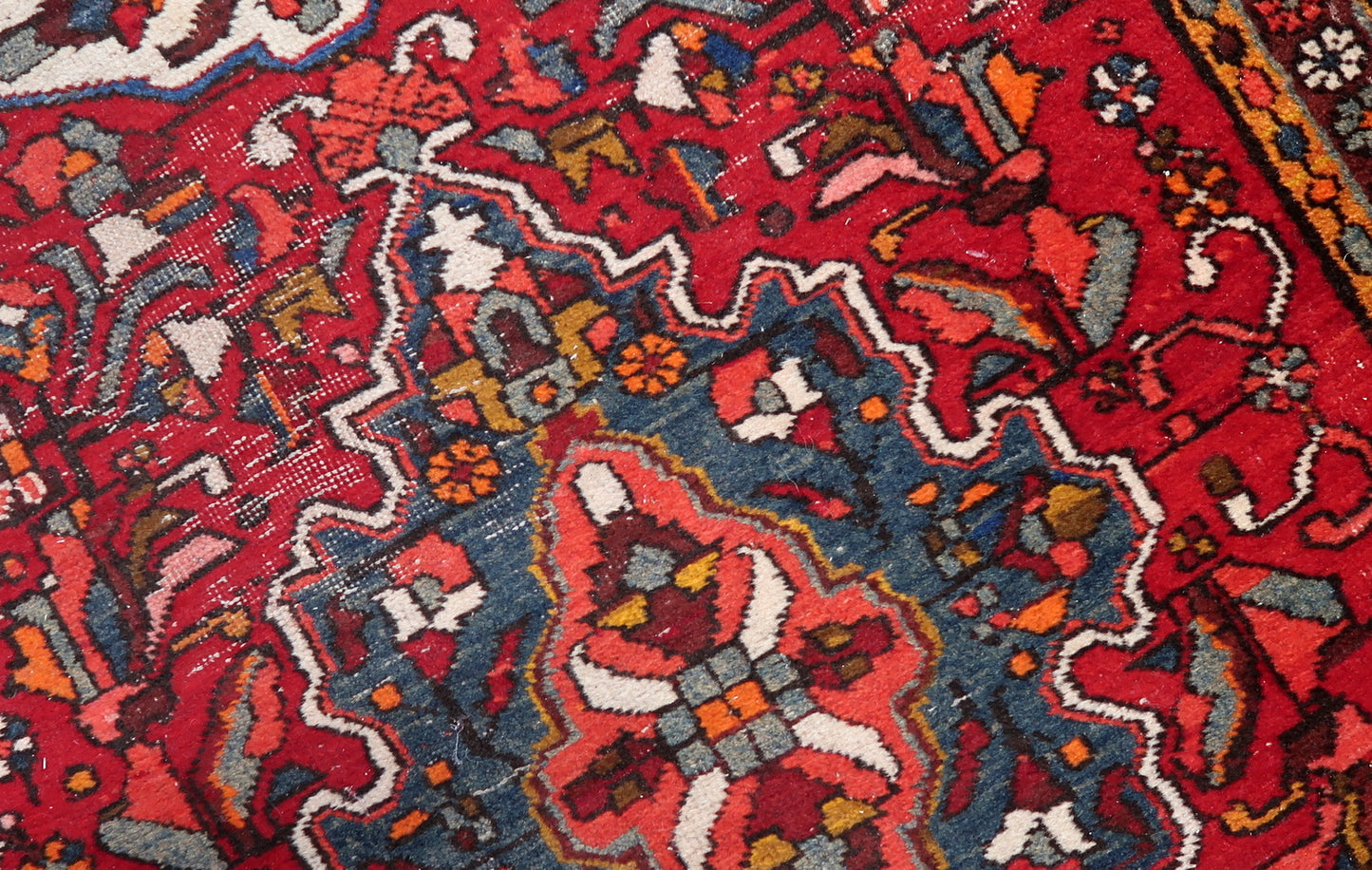 Authentic Persian Karajeh rug with vibrant hues and geometric details