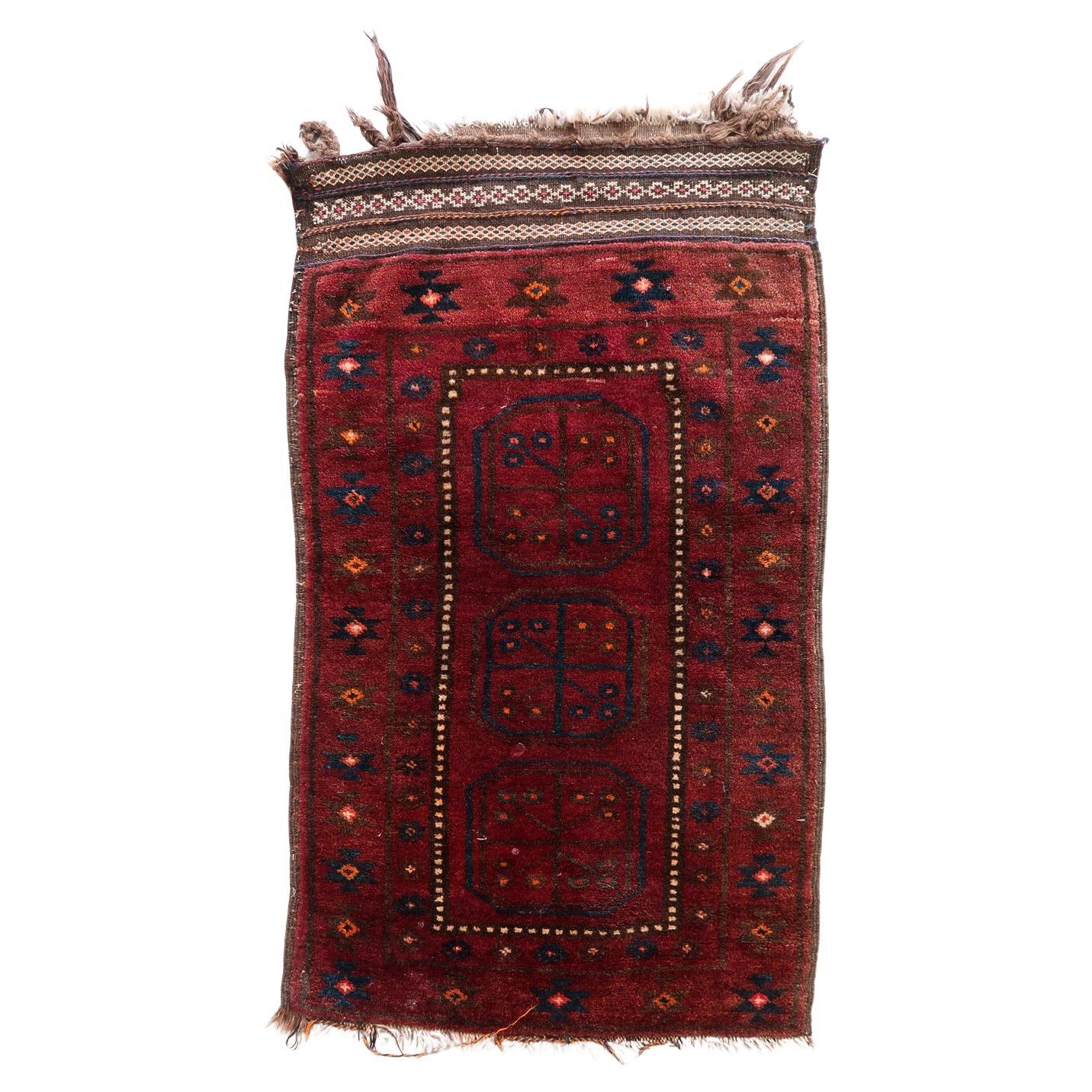 Handmade vintage Afghan Baluch rug with bold red and dark blue tones
