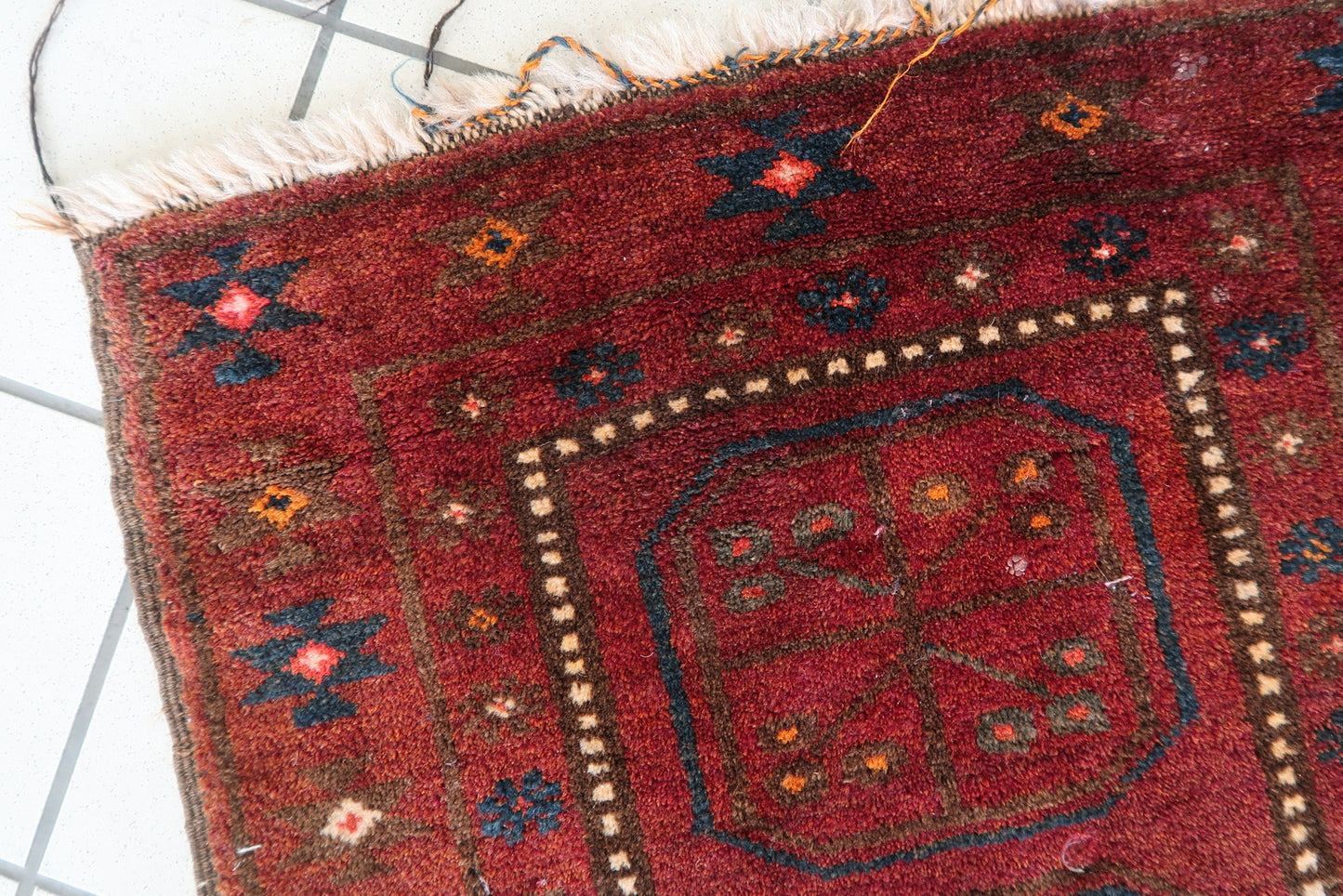 Hand-knotted Afghan Baluch rug with traditional tribal designs