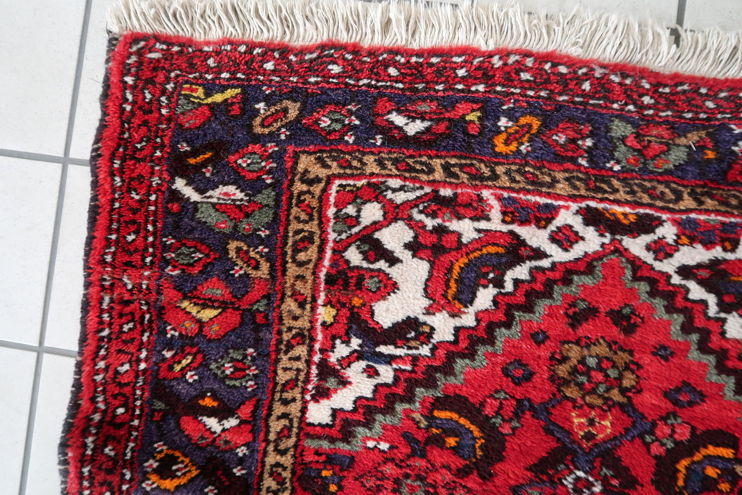 Intricate floral design on a handmade Persian wool rug