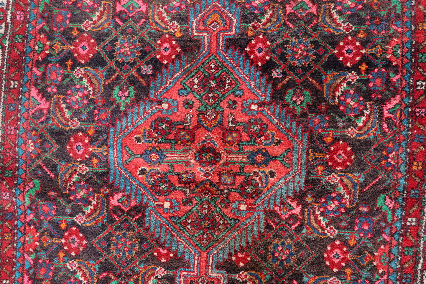 Decorative Persian wool rug with elegant floral patterns