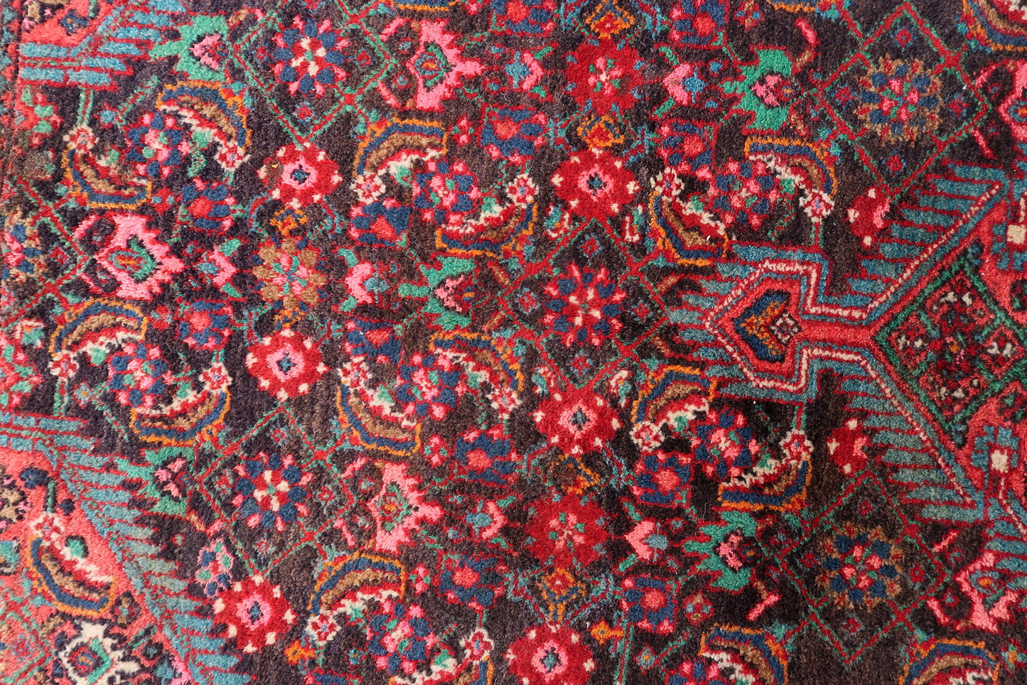 Handwoven Persian rug with traditional medallion design