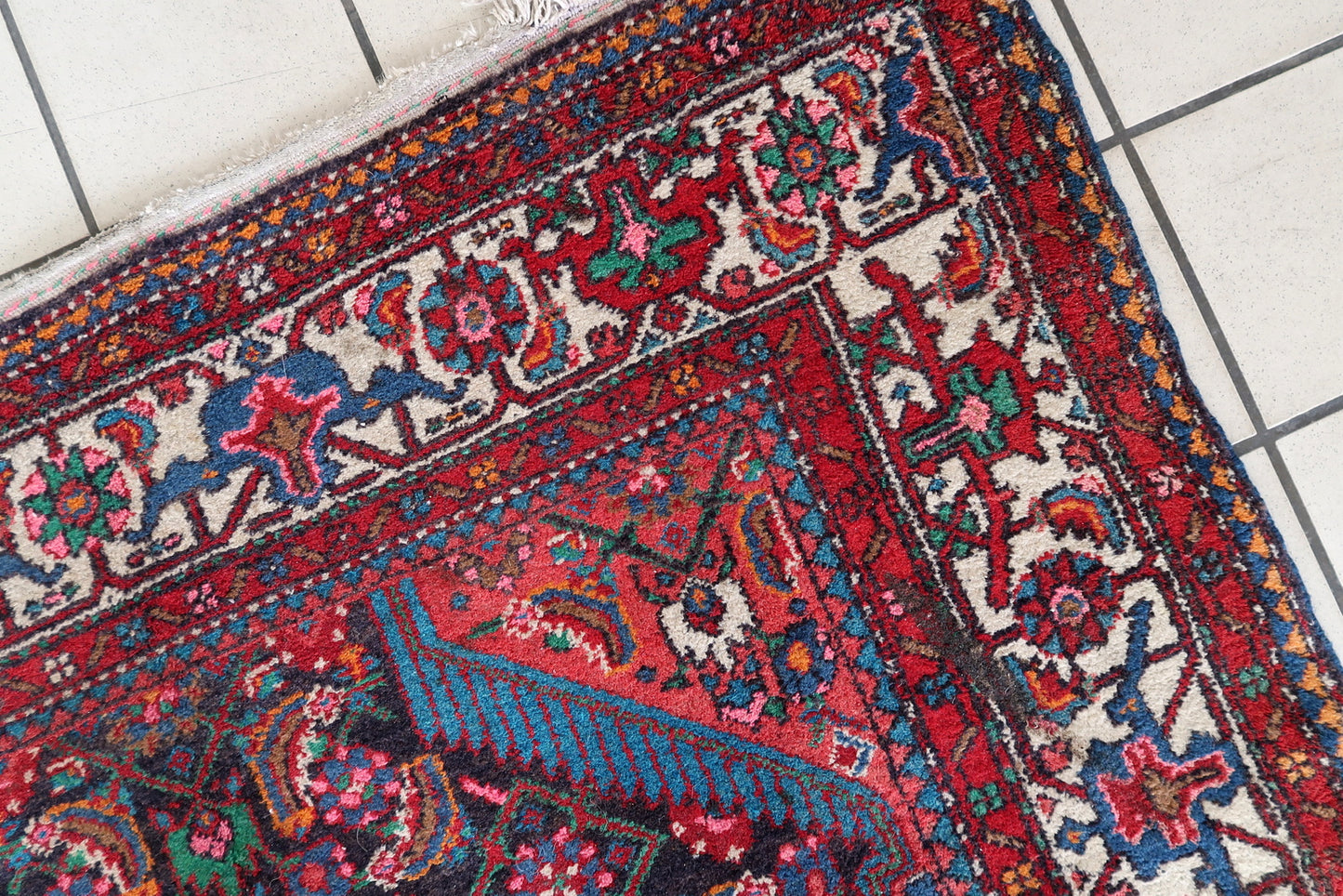 Intricate floral design on a handmade Persian wool rug