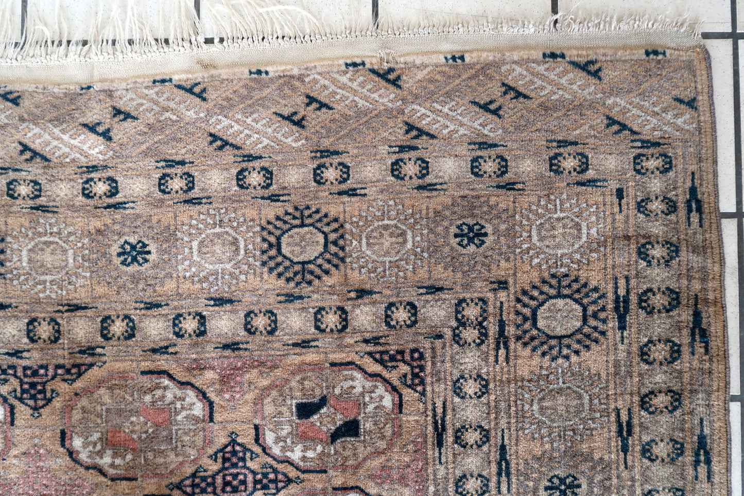 Intricate oval design on a handmade Afghan wool rug